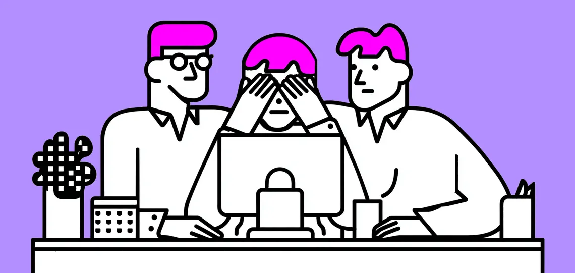 Image of two people tapping another person on the shoulder that sits in front of a computer screen.